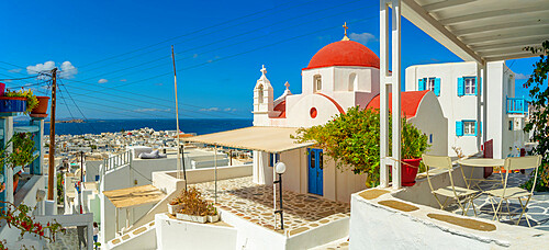 View of narrow street and red domed chapel overlooking Aegean Sea, Mykonos Town, Mykonos, Cyclades Islands, Greek Islands, Aegean Sea, Greece, Europe