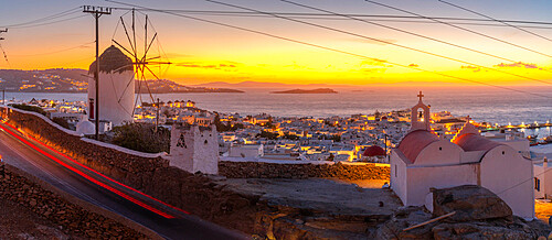 View of the windmills and town from elevated position at dusk, Mykonos Town, Mykonos, Cyclades Islands, Greek Islands, Aegean Sea, Greece, Europe