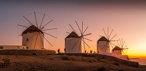 View of windmills at sunset, Mykonos Town, Mykonos, Cyclades Islands, Greek Islands, Aegean Sea, Greece, Europe