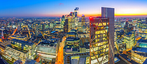 Panoramic view of City of London skyscrapers and Tower Bridge at dusk from the Principal Tower, London, England, United Kingdom, Europe