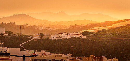 View of hillside houses and mountains at sunset near El Pagador, Las Palmas, Gran Canaria, Canary Islands, Spain, Atlantic, Europe