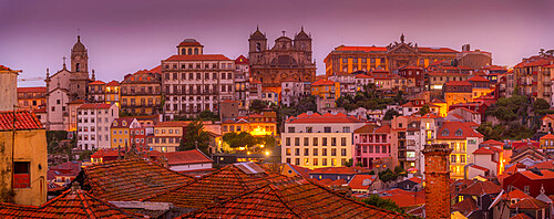 View of buildings and terracota rooftops of The Ribeira district at dusk, UNESCO World Heritage Site, Porto, Norte, Portugal, Europe