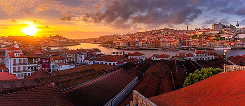 View of sunset over terracota rooftops and Douro River in the old town of Porto, Porto, Norte, Portugal, Europe