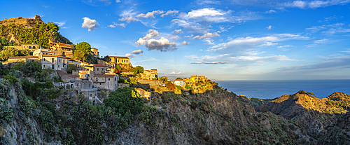 View of town of Savoca and Mediterranean Sea at sunset, Savoca, Messina, Sicily, Italy, Europe