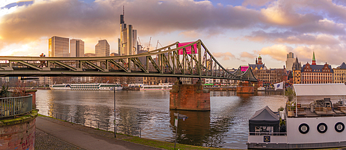 View of city skyline, River Main and Iron Footbridge at sunset, Frankfurt am Main, Hesse, Germany, Europe