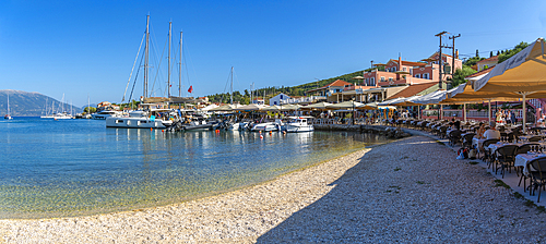 View of cafes and restaurants in Fiscardo harbour, Fiscardo, Kefalonia, Ionian Islands, Greek Islands, Greece, Europe