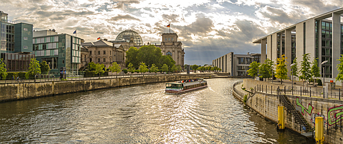 View of sightseeing cruise boat on River Spree and the Reichstag (German Parliament building), Mitte, Berlin, Germany, Europe