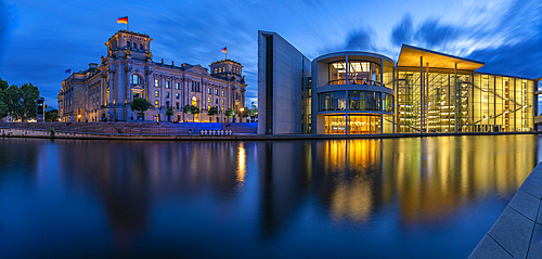 View of the River Spree and the Reichstag (German Parliament Building) and Paul Loebe Building at dusk, Mitte, Berlin, Germany, Europe