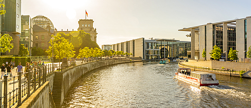 View of sightseeing cruise boat on River Spree and the Reichstag, German Parliament building, Mitte, Berlin, Germany, Europe