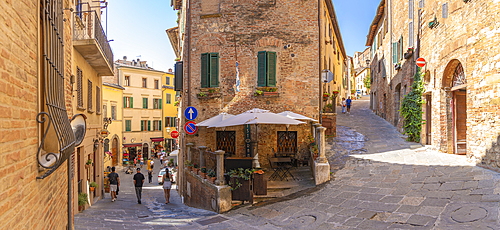 View of cafe and bar in narrow street in Montepulciano, Montepulciano, Province of Siena, Tuscany, Italy, Europe