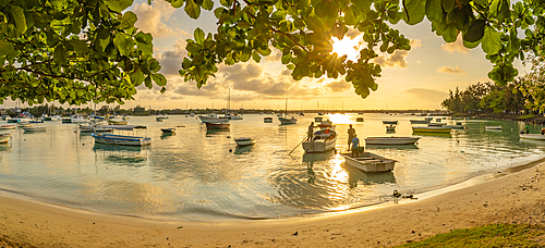 View of boats on the water in Grand Bay at golden hour, Mauritius, Indian Ocean, Africa