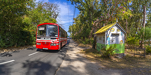 View of red bus and small shop in Cap Malheureux, Mauritius, Indian Ocean, Africa