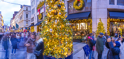 View of New Bond Street Christmas tree and shops at Christmas, Westminster, London, England, United Kingdom, Europe