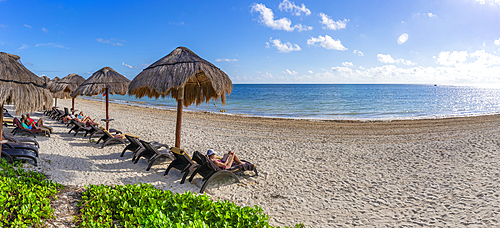 View of woman reading book on beach at Puerto Morelos, Caribbean Coast, Yucatan Peninsula, Riviera Maya, Mexico, North America