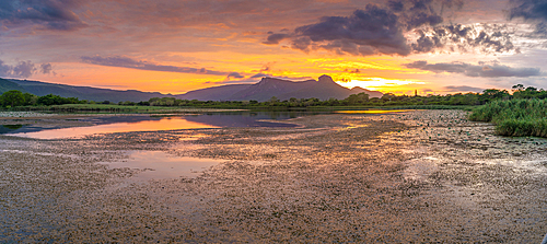 View of Jet lake and Ubombo Mountain from Ghost Mountain Inn at sunrise, Mkuze, KwaZulu-Natal Province, South Africa, Africa