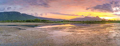 View of Jet lake and Ubombo Mountain from Ghost Mountain Inn at sunrise, Mkuze, KwaZulu-Natal Province, South Africa, Africa