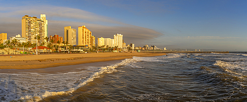 View of promenade, beach and hotels from pier in Indian Ocean at sunrise, Durban, KwaZulu-Natal Province, South Africa, Africa