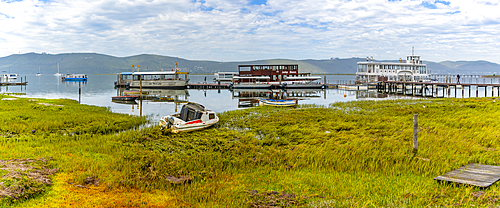 View of boats on Knysna River with Featherbed Nature Reserve in background, Knysna, Garden Route, Western Cape, South Africa, Africa