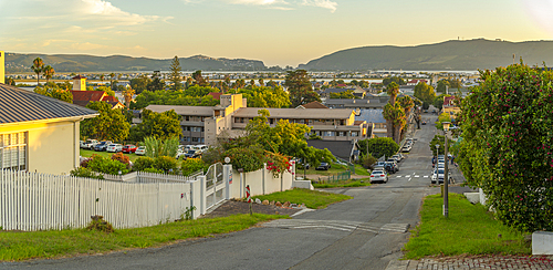 View of suburb street overlooking Knysna at sunset, Knysna, Garden Route, Western Cape, South Africa, Africa