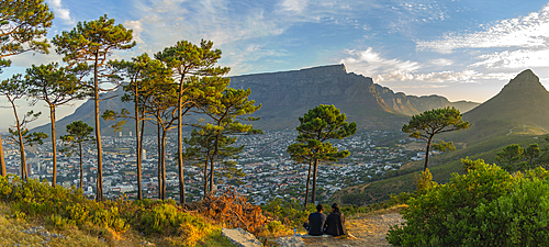 View of couple and Table Mountain from Signal Hill at sunset, Cape Town, Western Cape, South Africa, Africa