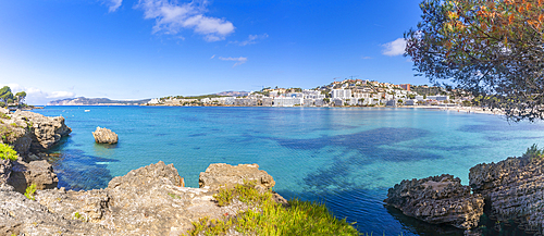 View of rocky shoreline by turquoise sea and Santa Ponsa, Majorca, Balearic Islands, Spain, Mediterranean, Europe