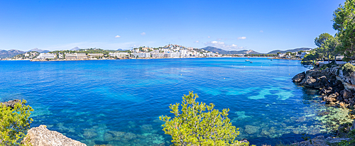 View of rocky shoreline by turquoise sea and Santa Ponsa, Majorca, Balearic Islands, Spain, Mediterranean, Europe