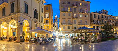 View of buildings and restaurants on Kofineta Square at dusk, Corfu Old Town, UNESCO World Heritage Site, Corfu, The Ionian Islands, Greek Islands, Greece, Europe