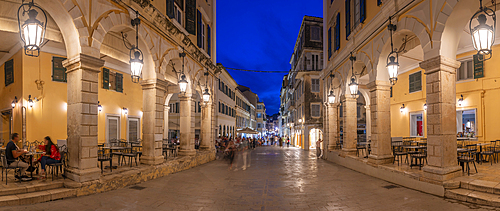 View of restaurant on Nikiforou Theotoki at dusk, Corfu Town, Corfu, Ionian Sea, Greek Islands, Greece, Europe