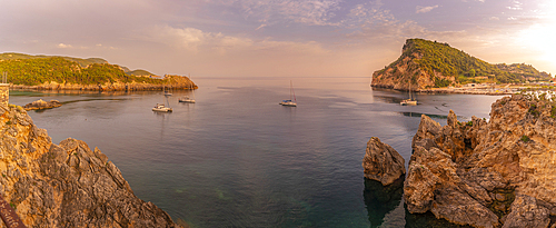 View of coastline and Ionian Sea near Palaiokastritsa at sunset, Palaiokastritsa, Corfu, Ionian Sea, Greek Islands, Greece, Europe