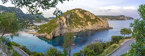 View of coastline from Monastery of Paleokastritsa at sunset, Palaiokastritsa, Corfu, Ionian Sea, Greek Islands, Greece, Europe