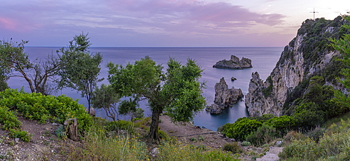 View of coastline from Monastery of Paleokastritsa at sunset, Palaiokastritsa, Corfu, Ionian Sea, Greek Islands, Greece, Europe