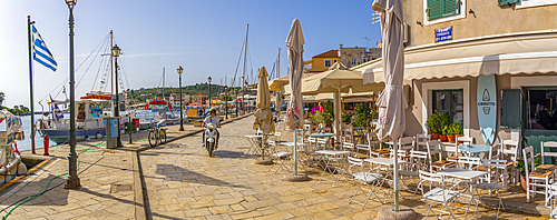 View of boats and cafes in the harbour in Gaios Town, Paxos, Ionian Sea, Greek Islands, Greece, Europe