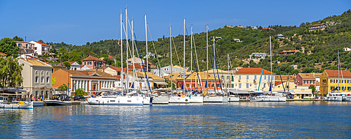 View of boats and colourful buildings in the harbour in Gaios Town, Paxos, Ionian Sea, Greek Islands, Greece, Europe