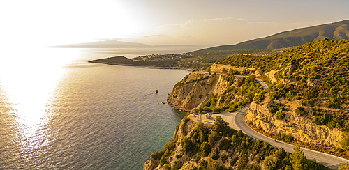 View of road and coastline at Northernmost point of Thassos island at sunset, Thassos, Aegean Sea, Greek Islands, Greece, Europe