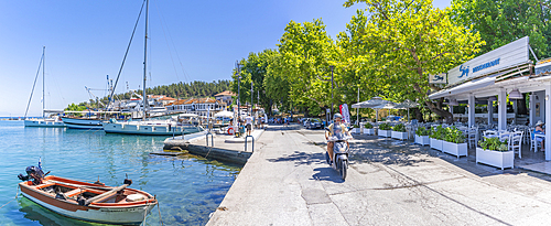 View of restaurant and boats in Thassos Town, Thassos, Aegean Sea, Greek Islands, Greece, Europe