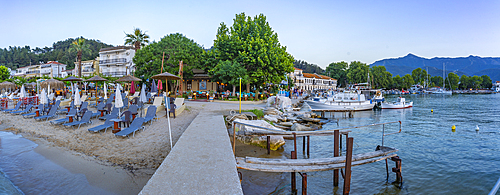 View of boats and harbour in Thassos Town at dusk, Thassos, Aegean Sea, Greek Islands, Greece, Europe