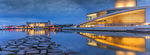 View of buildings and Oslo Opera House reflecting in harbour at dusk, Oslo, Norway, Scandinavia, Europe