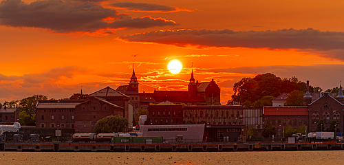 View of the Akershus Fortress and city skyline at sunset, Oslo, Norway, Scandinavia, Europe