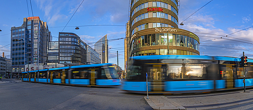 View of buildings and city trams in Jernbanetorget, Oslo, Norway, Scandinavia, Europe