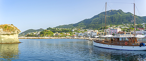 View of sailboat and town of Lacco Ameno, Island of Ischia, Campania, Italy, Europe