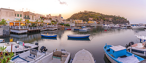 View of harbour and the town of Lacco Ameno at sunset, Island of Ischia, Campania, Italy, Europe