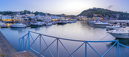 View of harbour and town of Lacco Ameno at dusk, Island of Ischia, Campania, Italy, Europe