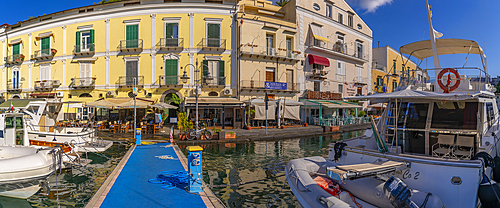 View of boats and restaurants in Porto d'Ischia (Port of Ischia), Island of Ischia, Campania, Italy, Europe