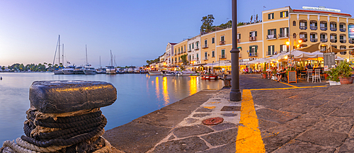 View of restaurants in Porto d'Ischia (Port of Ischia) at dusk, Island of Ischia, Campania, Italy, Europe