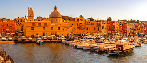 View of Church of Santa Maria della Pieta in the fishing port Marina Grande with boats at golden hour, Procida, Phlegraean Islands, Gulf of Naples, Campania, Southern Italy, Italy, Europe