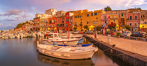 View of the fishing port Marina Grande with boats at golden hour, Procida, Phlegraean Islands, Gulf of Naples, Campania, Southern Italy, Italy, Europe