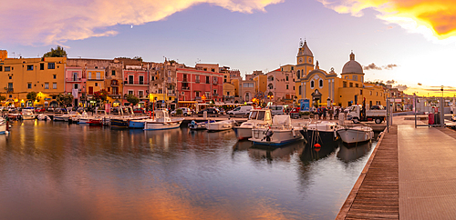 View of Church Madonna delle Grazie in the fishing port Marina Grande with boats at golden hour, Procida, Phlegraean Islands, Gulf of Naples, Campania, Southern Italy, Italy, Europe