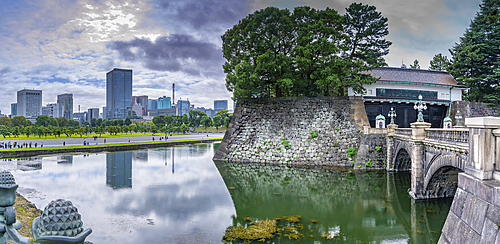 View of city skyline and Nijubashi bridge over the moat, The Imperial Palace of Tokyo, Tokyo, Honshu, Japan, Asia