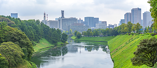 View of city buildings and Sakuradabori Moat of the Imperial Palace, Chiyoda, Tokyo, Honshu, Japan