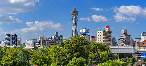 View of Tsutenkaku Tower and city skyline on a sunny day in the Shinsekai area, Osaka, Honshu, Japan